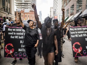 People from the Blacks Lives Matter movement march during the Pride parade in Toronto, Sunday, June 25, 2017.