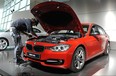 This file photo taken on October 14, 2011 shows an employee preparing a new BMW 328i for display during its presentation in the southern German city of Munich.
German luxury carmaker BMW on November 3, 2017 said it was recalling "approximately one million vehicles" in North America over two separate problems that could lead to fire risks. (ANDREAS GEBERT/AFP/Getty Images)