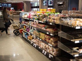 Various brands of bread sit on shelves in a grocery store in Toronto on Wednesday Nov. 1, 2017. Investors in major Canadian grocers appear unfazed today after the Competition Bureau raided the offices of certain companies in a criminal probe tied to alleged price fixing of some packaged bread products. (THE CANADIAN PRESS/Doug Ives)