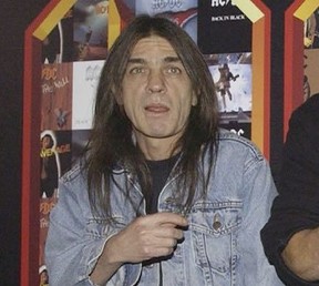 A March 3, 2003 file photo of AC/DC co-founder and guitarist Malcolm Young at an event in London. The band has announced, Saturday Nov. 18, 2017,  that 64-year-old Young has died. (Yui Mok/PA via AP)
