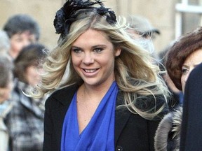 In this Saturday, Feb. 26, 2011 file photo, Chelsy Davy arrives at the wedding of the Duke and Duchess of Northumberland's eldest daughter Lady Katie Percy to city financier Patrick Valentine at St Michael's Church in Alnwick, England.
