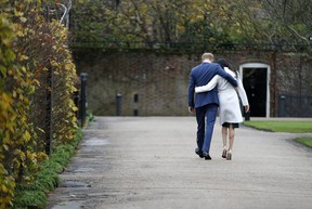 Britain’s Prince Harry and Meghan Markle walk away after posing for the media in the grounds of Kensington Palace in London, Monday Nov. 27, 2017. It was announced Monday that Prince Harry, fifth in line for the British throne, will marry American actress Meghan Markle in the spring, confirming months of rumors. (AP Photo/Alastair Grant)