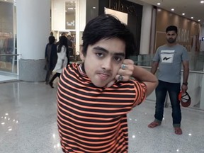 In this screenshot, Muhammad Sameer Khan, 14, of Karachi, Pakistan turns his head 180-degrees.