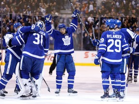 Connor Carrick and the Toronto Maple Leafs celebrate a win over the New Jersey Devils on Nov. 16, 2017