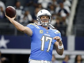 Los Angeles Chargers quarterback Philip Rivers (17) throws a pass during warm ups before an NFL football game against the Dallas Cowboys on Thursday, Nov. 23, 2017, in Arlington, Texas. (AP Photo/Michael Ainsworth)