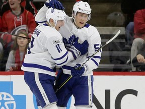 Toronto Maple Leafs' Zach Hyman celebrates with Jake Gardiner during a game against the Carolina Hurricanes on Nov. 24, 2017