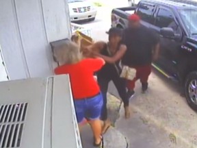 Nathaniel Eric Smith and Latasha Smith were captured on video beating the owner of the Qwik Chik restaurant in a dispute over a fried chicken order. (YouTube/WCMH)