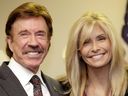 In this Dec. 2, 2010 file photo, actor Chuck Norris, left, and his wife Gena pose for a photo following a ceremony in Garland, Texas. Norris is taking on medical device manufacturers in a lawsuit alleging a chemical used in MRI imaging scans poisoned his wife. The lawsuit filed on Wednesday, Nov. 1, 2017, in San Francisco says gadolinium that doctors injected into Gena Norris to improve the clarity of her MRIs have left her weak and tired and with debilitating bouts of pain and a burning sensation. (AP Photo/Tony Gutierrez, File)