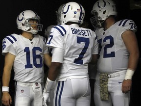 Jacoby Brissett, Scott Tolzien and Mike Person of the Indianapolis Colts huddle on Nov. 5, 2017