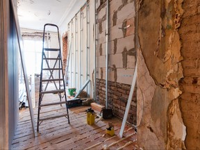 Interior of apartment with materials during on the renovation and construction ( making wall from gypsum plasterboard)
