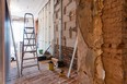 Interior of apartment with materials during on the renovation and construction ( making wall from gypsum plasterboard)