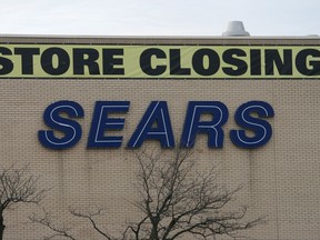 A store closing sign is shown on a Sears store at the Oakville Place mall in Oakville on Thursday, Nov. 23, 2017.  THE CANADIAN PRESS/Richard Buchan