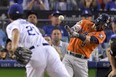 Houston Astros' Marwin Gonzalez hits a double off Los Angeles Dodgers starting pitcher Yu Darvish, of Japan, during the second inning of Game 7 of the World Series Wednesda in Los Angeles. (AP Photo/Mark J. Terrill)