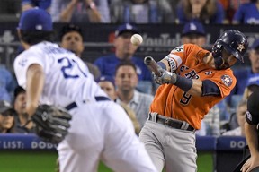 Houston Astros' Marwin Gonzalez hits a double off Los Angeles Dodgers starting pitcher Yu Darvish, of Japan, during the second inning of Game 7 of the World Series Wednesda in Los Angeles. (AP Photo/Mark J. Terrill)