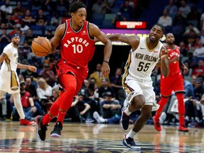 Toronto Raptors guard DeMar DeRozan drives on New Orleans Pelicans guard E'Twaun Moore on Nov. 15, 2017