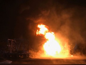 Vehicles burn on Hwy. 400 south of Barrie on Wednesday, Nov. 1, 2017.