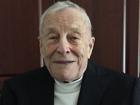 Clare Drake wearing his Hockey Hall of Fame blazer on Sept. 26, 2017