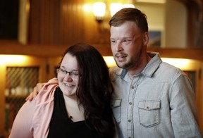 Lilly Ross, left, talks with Andy Sandness after meeting at the Mayo Clinic, Friday, Oct. 27, 2017, in Rochester, Minn. Sixteen months after transplant surgery gave Sandness the face that once belonged to Calen "Rudy" Ross, he met the woman who had agreed to donate her high school sweetheart's face to a man who lived nearly a decade without one. (AP Photo/Charlie Neibergall)