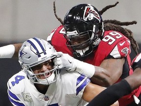 FILE-This Nov. 12, 2017, file photo shows Atlanta Falcons defensive end Adrian Clayborn (99) sacking Dallas Cowboys quarterback Dak Prescott (4) during the first half of an NFL football game, in Atlanta.  Since turning in one of the greatest pass-rushing performances in NFL history, Clayborn has doled out Thanksgiving meals to the needy, shaken hands with Jay-Z _ and gotten the brush-off from his dogs. Turns out, Ace and King were none too impressed with those six sacks. When he jumped on the floor to play with them, they ignored their owner and started jostling with each other. "My dogs don't like me very much," Clayborn joked Thursday, Nov. 16, 2017.  (AP Photo/David Goldman, File) ORG XMIT: NYSH907

AP FILE PHOTO OF NOV. 12, 2017
David Goldman, AP