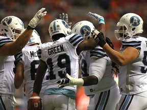 Toronto Argonauts' S.J. Green is congratulated by his teammates after a touchdown against the BC Lions on Saturday, November 4, 2017. (THE CANADIAN PRESS/Chad Hipolito)