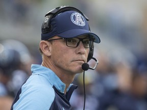 Toronto Argonauts head coach Marc Trestman looks on before his team kicks off first half CFL football action against the BC Lions, in Toronto. THE CANADIAN PRESS/Chris Young