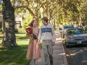 This image released by A24 Films shows Saoirse Ronan, left, and Lucas Hedges in a scene from "Lady Bird." (Merie Wallace/A24 via AP)