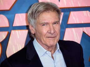 In this Sept. 21, 2017, file photo, actor Harrison Ford poses for photographers during the photo call for 'Blade Runner 2049' in London. Police tell the Ventura County, Calif. Star newspaper that Ford and others helped a woman involved in an accident on Nov. 19, 2017, out of her car before first responders arrived. (Photo by Joel Ryan/Invision/AP, File)