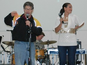 In this handout photo from 2006 provided by the U.S. Army, Al Franken and Leann Tweeden entertain the Soldiers with a skit at Forward Operating Base Marez in Mosul, Iraq on Dec. 16, 2006. (Creighton Holub/U.S. Army via Getty Images)
