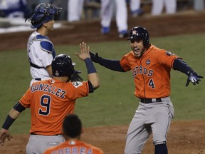 Astros' George Springer celebrates after his two-run home run against the Dodgers during Game 7