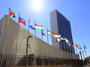 In this file photo, the United Nations headquarters is seen in New York as member countries' flags fly outside.