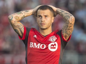 Toronto FC forward Sebastian Giovinco reacts after teammate Jozy Altidore missed a goal scoring opportunity against the Portland Timbers during second half MLS action in Toronto on Saturday, August 12, 2017.  CANADIAN PRESS/Chris Young
