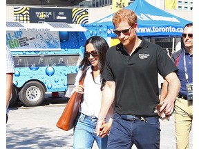 Prince Harry and Meghan Markle at Nathan Phillps Sq. during the Invictus games wheelchair tennis on Monday, Sept. 25, 2017.