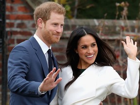 Prince Harry and Meghan Markle during an official photocall to announce the engagement of Prince Harry and actress Meghan Markle at The Sunken Gardens at Kensington Palace on Nov. 27, 2017 in London, England. (Chris Jackson/Getty Images)