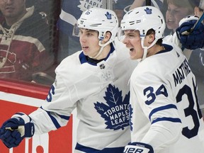 Toronto Maple Leafs' Auston Matthews (34) celebrates with teammate Mitchell Marner after scoring against the Montreal Canadiens during third period NHL hockey action in Montreal, Saturday, November 18, 2017. THE CANADIAN PRESS/Graham Hughes