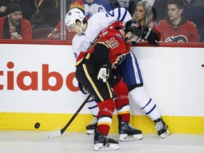 Toronto Maple Leafs' William Nylander, left, tries to get past Calgary Flames' Matt Stajan during second period NHL hockey action in Calgary, Tuesday, Nov. 28, 2017.THE CANADIAN PRESS/Jeff McIntosh