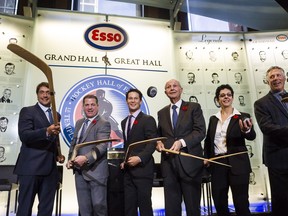 2017 Hockey Hall of Fame inductees, (from left) Teemu Selanne, Mark Recchi, Paul Kariya, Jeremy Jacobs, Danielle Goyette and Dave Andreychuk put pucks in the air during a press Conference in Toronto yesterday.