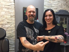 Al Jackson, owner of Reverence Tattoo at 3140 Dundas St. W., has been offering free poppy tattoos for people over 18 with a suggested $20 donation towards poppy sales. Supplied.