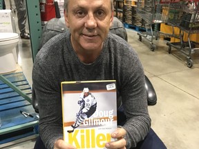 Doug Gilmour holds a copy of his newly released book, Killer.