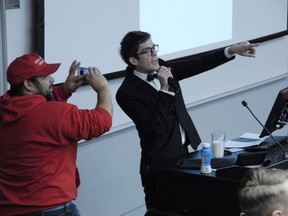 In this Nov. 28, 2017 photo, Lucian Wintrich, White House correspondent for the right-wing blog Gateway Pundit, speaks at the University of Connecticut in Storrs, Conn.