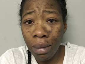 This undated photo provided by the Round Lake Beach, Ill., Police Department shows Jamie Jones. Jones, accused of taking her 6-year-old onto a commuter train to Chicago after his death last summer has been charged with first-degree murder and ordered held without bond, authorities said Tuesday, Nov. 7, 2017. Jones, 29, of Round Lake Beach also was charged with concealment of a homicide in the death of Carl Rice Jr. She's being held in lieu of $3 million. (Round Lake Beach Police Department via AP)