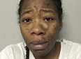 This undated photo provided by the Round Lake Beach, Ill., Police Department shows Jamie Jones. Jones, accused of taking her 6-year-old onto a commuter train to Chicago after his death last summer has been charged with first-degree murder and ordered held without bond, authorities said Tuesday, Nov. 7, 2017. Jones, 29, of Round Lake Beach also was charged with concealment of a homicide in the death of Carl Rice Jr. She's being held in lieu of $3 million. (Round Lake Beach Police Department via AP)