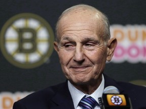 Boston Bruins owner Jeremy Jacobs listens to a reporter's question during a news conference in 2004