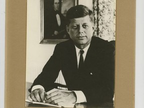 This undated image provided by Nathan Raab, president of rare documents dealer The Raab Collection in Ardmore, Pa., shows an autographed photo that U.S. ambassador Thomas Estes received from President John F. Kennedy when Estes met with the president on Nov. 21, 1963, the day before Kennedy's assassination. The rare documents dealer was offering the autographed photo for purchase in November 2017 with an asking price of $80,000. The inscription reads: "To Ambassador Estes. With esteem and very warm regards. John F. Kennedy." (Nathan Raab/The Raab Collection via AP)