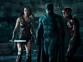 Gal Gadot (Wonder Woman), Ben Affleck (Batman) and Ezra Miller (The Flash) in a scene from Justice League. (Warner Bros.)