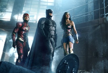 (L-r) EZRA MILLER as The Flash, BEN AFFLECK as Batman and GAL GADOT as Wonder Woman in Warner Bros. Pictures' action adventure "JUSTICE LEAGUE," a Warner Bros. Pictures release.