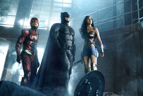 (L-r) EZRA MILLER as The Flash, BEN AFFLECK as Batman and GAL GADOT as Wonder Woman in Warner Bros. Pictures' action adventure