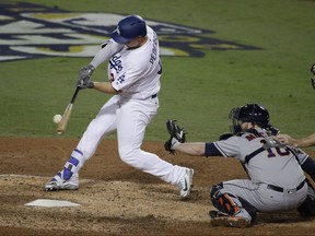 Dodgers' Joc Pederson hits a home run against the Astros during the seventh inning of Game 6 of the World Series in Los Angeles on Tuesday, Oct. 31, 2017. (Jae C. Hong/AP Photo)