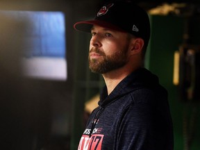 Corey Kluber of the Cleveland Indians looks on from the dugout on Oct. 11, 2017