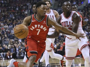 Raptors guard Kyle Lowry (7) drives to the basket as Bulls players defend during NBA action in Toronto on Tuesday, Nov. 7, 2017. (Veronica Henri/Toronto Sun)
