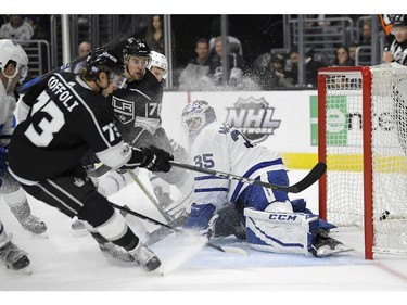 Toronto Maple Leafs goalie Curtis McElhinney, right, gives up a goal to Los Angeles Kings center Tyler Toffoli during the second period of an NHL hockey game, Thursday, Nov. 2, 2017, in Los Angeles.